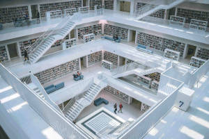 Thumbnail of 4 floors with books and stairs. People walking around and hanging out