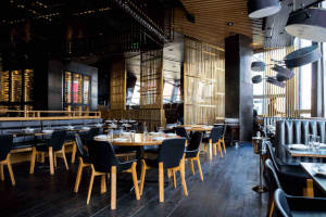 Thumbnail of dining area with tables and chairs