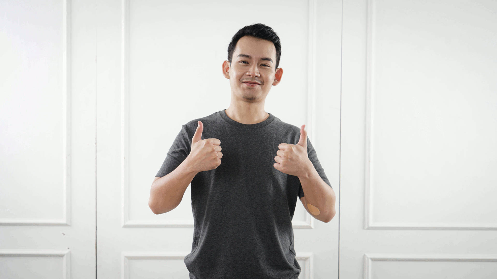 Man with two thumbs up